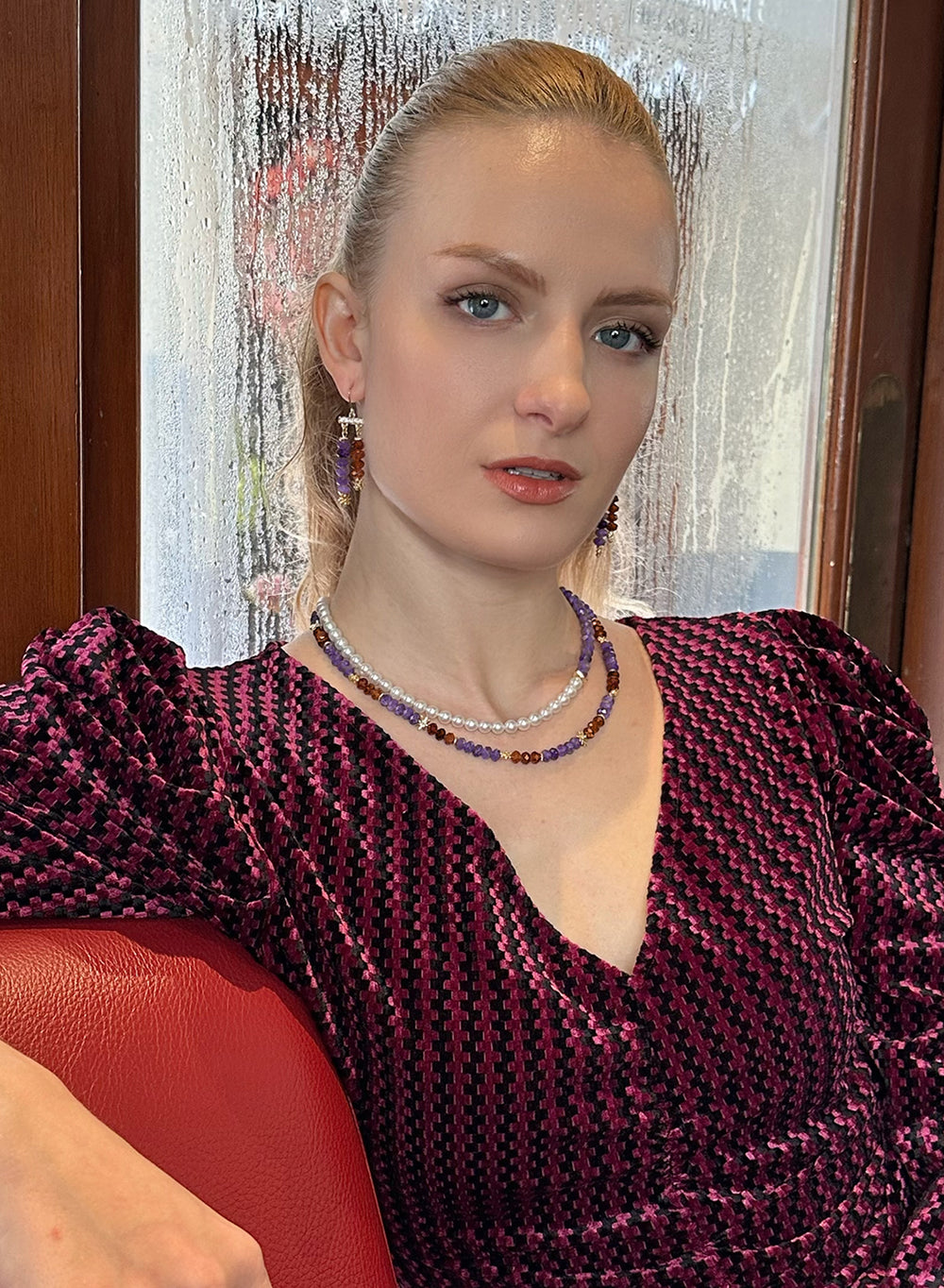 This exquisite piece seamlessly blends the regal charm of amethyst with the vibrant allure of orange garnet, creating a stunning contrast that captivates attention.