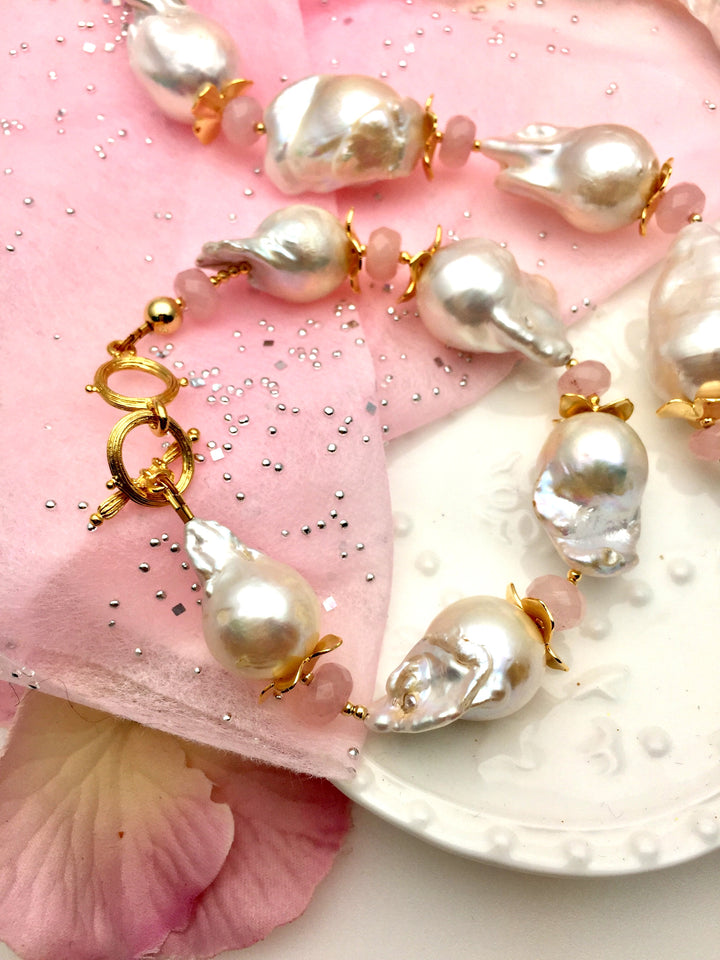 Elevate your look with the unique charm of Baroque pearls and the soothing essence of Rose Quartz – a must-have addition to your jewelry collection.