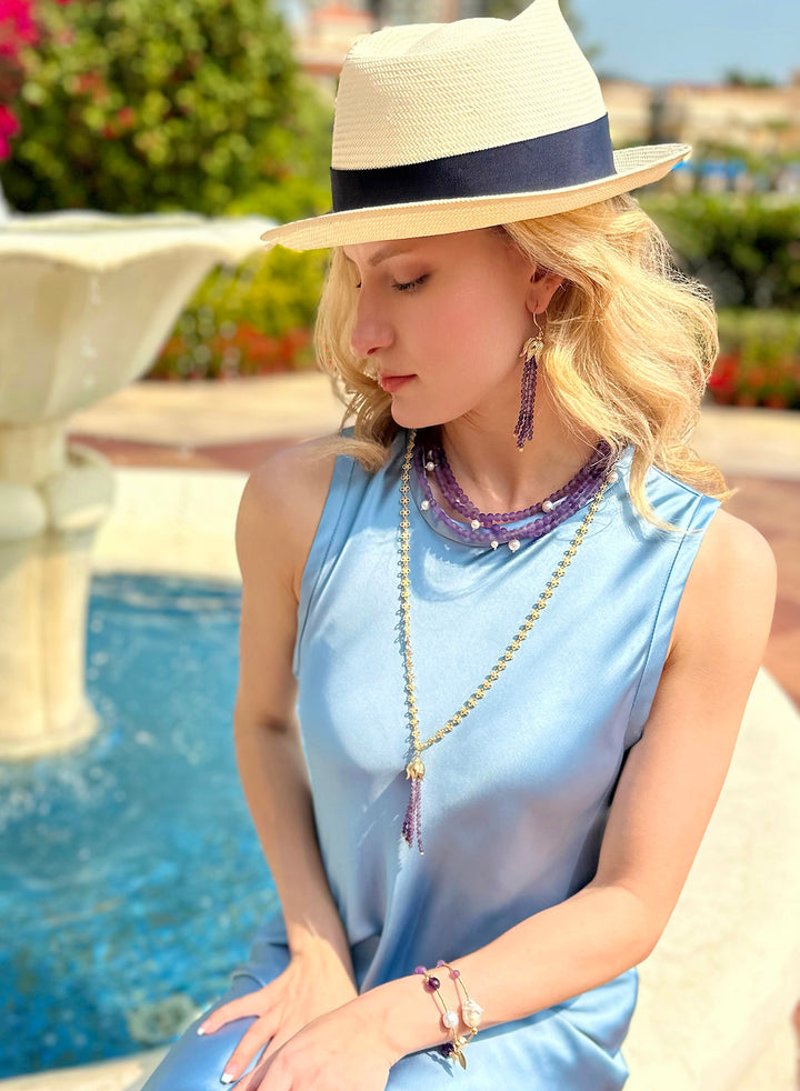 This exquisite piece features two strands of radiant amethyst beads, carefully selected to showcase the gem's natural beauty.